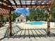 Stunning community pool with comfortable lounge seating and shade at 306 Atley Pl, Alpharetta, GA 30009