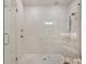 Walk-in shower featuring white tiles, a glass door, and dual shower heads at 306 Atley Pl, Alpharetta, GA 30009