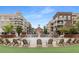 Town square featuring a central water fountain with seating and lush greenery, surrounded by multi-story buildings at 306 Atley Pl, Alpharetta, GA 30009