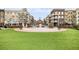 Town square with a water fountain, park benches, and manicured landscaping in a bustling area surrounded by buildings at 306 Atley Pl, Alpharetta, GA 30009