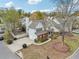 Aerial view of a two-story home with a well-manicured lawn, attached garage, and landscaped yard at 4845 Weathervane Dr, Alpharetta, GA 30022