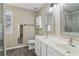 This bathroom offers double sinks, gray cabinets, and neutral paint at 4845 Weathervane Dr, Alpharetta, GA 30022