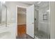 The bathroom offers a shower with glass door and gray vinyl flooring at 4845 Weathervane Dr, Alpharetta, GA 30022
