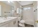 This bathroom has a shower-tub, white cabinets, and modern fixtures at 4845 Weathervane Dr, Alpharetta, GA 30022