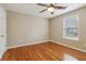 Bedroom with hardwood floors, a ceiling fan, and one window at 4845 Weathervane Dr, Alpharetta, GA 30022