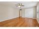 Bedroom with hardwood floors, a ceiling fan, and a closet at 4845 Weathervane Dr, Alpharetta, GA 30022