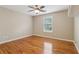 Bedroom with hardwood floors, a ceiling fan, and one window at 4845 Weathervane Dr, Alpharetta, GA 30022