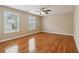 Spacious bedroom with hardwood floors and large windows, offering plenty of natural light at 4845 Weathervane Dr, Alpharetta, GA 30022