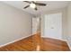 Bedroom with hardwood floors, a ceiling fan, and a closet at 4845 Weathervane Dr, Alpharetta, GA 30022