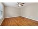 Spacious bedroom featuring hardwood floors and a ceiling fan at 4845 Weathervane Dr, Alpharetta, GA 30022