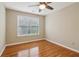 Bedroom with hardwood floors, a ceiling fan, and one window at 4845 Weathervane Dr, Alpharetta, GA 30022
