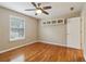 Bedroom with hardwood floors, a ceiling fan, and one window at 4845 Weathervane Dr, Alpharetta, GA 30022