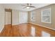 Bedroom with hardwood floors, a ceiling fan, and windows at 4845 Weathervane Dr, Alpharetta, GA 30022