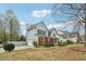 This two-story home with a brick facade features a side-entry garage and mature landscaping in a well-kept neighborhood at 4845 Weathervane Dr, Alpharetta, GA 30022