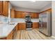 Updated kitchen with stainless steel appliances, wood cabinets, and light countertops, perfect for cooking at 4845 Weathervane Dr, Alpharetta, GA 30022
