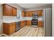 Updated kitchen with stainless steel appliances, wood cabinets, and light countertops, perfect for cooking at 4845 Weathervane Dr, Alpharetta, GA 30022