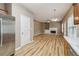 Open living area with a cozy fireplace, built-in shelving, and hardwood floors at 4845 Weathervane Dr, Alpharetta, GA 30022