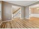 Open-concept living space with hardwood floors, elegant trim, and ample natural light creates an inviting atmosphere at 4845 Weathervane Dr, Alpharetta, GA 30022