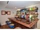 The basement bar features great barstool seating and a diverse selection of spirits at 525 Sycamore Pt, Woodstock, GA 30189