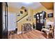 Finished basement area showcases a wine rack, decor, and access to the staircase at 525 Sycamore Pt, Woodstock, GA 30189