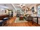 Open basement floor plan featuring seating, bar, entertainment, and kitchenette at 525 Sycamore Pt, Woodstock, GA 30189