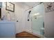Updated bathroom featuring a glass shower, modern fixtures, and stylish tile at 525 Sycamore Pt, Woodstock, GA 30189