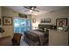Bright bedroom featuring a ceiling fan, and a desk, with lots of natural light at 525 Sycamore Pt, Woodstock, GA 30189