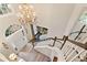 Spacious foyer featuring a staircase, hardwood floors, and a chandelier at 525 Sycamore Pt, Woodstock, GA 30189