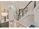 Bright foyer with hardwood floors, staircase, and a front door with a large arched window at 525 Sycamore Pt, Woodstock, GA 30189