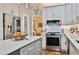 Modern kitchen showcasing sleek countertops, stainless steel appliances, and ample cabinet space at 525 Sycamore Pt, Woodstock, GA 30189