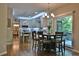 Open kitchen with modern appliances, a kitchen island, and a view of the dining and living spaces at 525 Sycamore Pt, Woodstock, GA 30189
