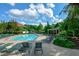 A refreshing swimming pool area with ample lounge seating and a covered gazebo, perfect for relaxation at 525 Sycamore Pt, Woodstock, GA 30189