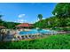 Exterior view of a community pool with lounge chairs and umbrellas, creating a relaxing atmosphere for residents at 525 Sycamore Pt, Woodstock, GA 30189