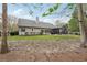 Backyard featuring a screened porch and lush green lawn at 1145 Prospect Mill Dr, Lawrenceville, GA 30043