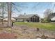 Well-kept backyard featuring a sunroom and a decorative rock garden at 1145 Prospect Mill Dr, Lawrenceville, GA 30043
