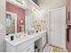 Bright bathroom with double sinks and white cabinets provides ample counter space and storage at 1145 Prospect Mill Dr, Lawrenceville, GA 30043