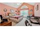 Cozy bedroom with vaulted ceiling, large window, and comfortable seating area at 1145 Prospect Mill Dr, Lawrenceville, GA 30043