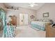 Cozy bedroom with an adjacent bathroom and a charming writing desk area at 1145 Prospect Mill Dr, Lawrenceville, GA 30043