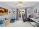 Bedroom featuring large windows, blue accent wall, and neutral carpet at 1145 Prospect Mill Dr, Lawrenceville, GA 30043