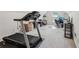 Spacious bonus room with a treadmill and workspace, ideal for fitness and productivity at 1145 Prospect Mill Dr, Lawrenceville, GA 30043