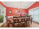 Bright dining room with hardwood floors and a classic chandelier at 1145 Prospect Mill Dr, Lawrenceville, GA 30043