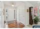 Inviting foyer with hardwood floors, white trim, and a view to the living space at 1145 Prospect Mill Dr, Lawrenceville, GA 30043