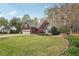 Beautiful brick home featuring an attached garage, well-maintained lawn, and lovely landscaping at 1145 Prospect Mill Dr, Lawrenceville, GA 30043