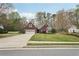A beautiful one-story brick home with an attached garage, long driveway, and well-maintained lawn at 1145 Prospect Mill Dr, Lawrenceville, GA 30043