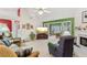 Bright living room featuring a fireplace and access to the sunroom at 1145 Prospect Mill Dr, Lawrenceville, GA 30043