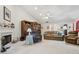 Light-filled living room featuring a fireplace and built-in shelving at 1145 Prospect Mill Dr, Lawrenceville, GA 30043
