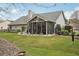 Cozy sunroom overlooking a manicured lawn and lovely landscaping at 1145 Prospect Mill Dr, Lawrenceville, GA 30043