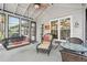 Comfortable sunroom with a porch swing and outdoor seating area for relaxing and entertaining at 1145 Prospect Mill Dr, Lawrenceville, GA 30043