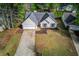 An aerial view of the lovely home showcasing its curb appeal, two-car garage, and well-kept lawn at 2643 Herndon Nw Rd, Lawrenceville, GA 30043