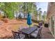 Inviting backyard patio with brick pavers, outdoor seating, and lush greenery at 2643 Herndon Nw Rd, Lawrenceville, GA 30043